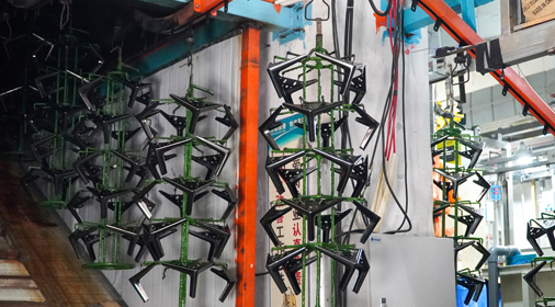 Spray painting process for sofa legs, highlighting DELTA CAINA's advanced finishing techniques for durable and visually appealing furniture hardware solutions.